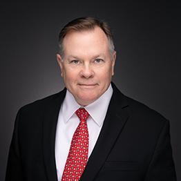 Photo of Darrell R. Caudill, Jr. with dark background.