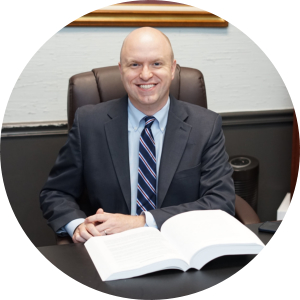 Photo of Cory P. DeBord at a desk.